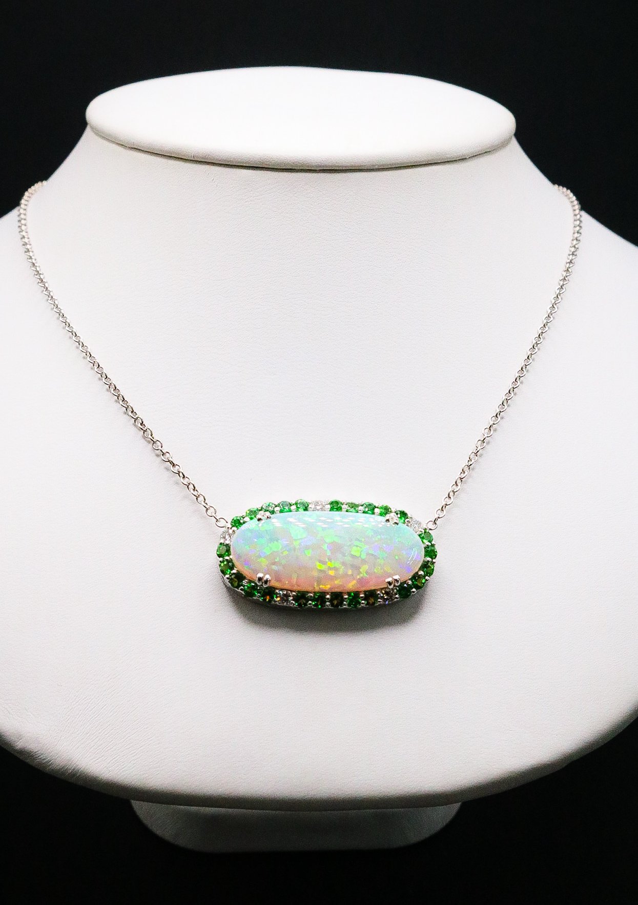 Opal necklace with green garnet halo on white gold chain
